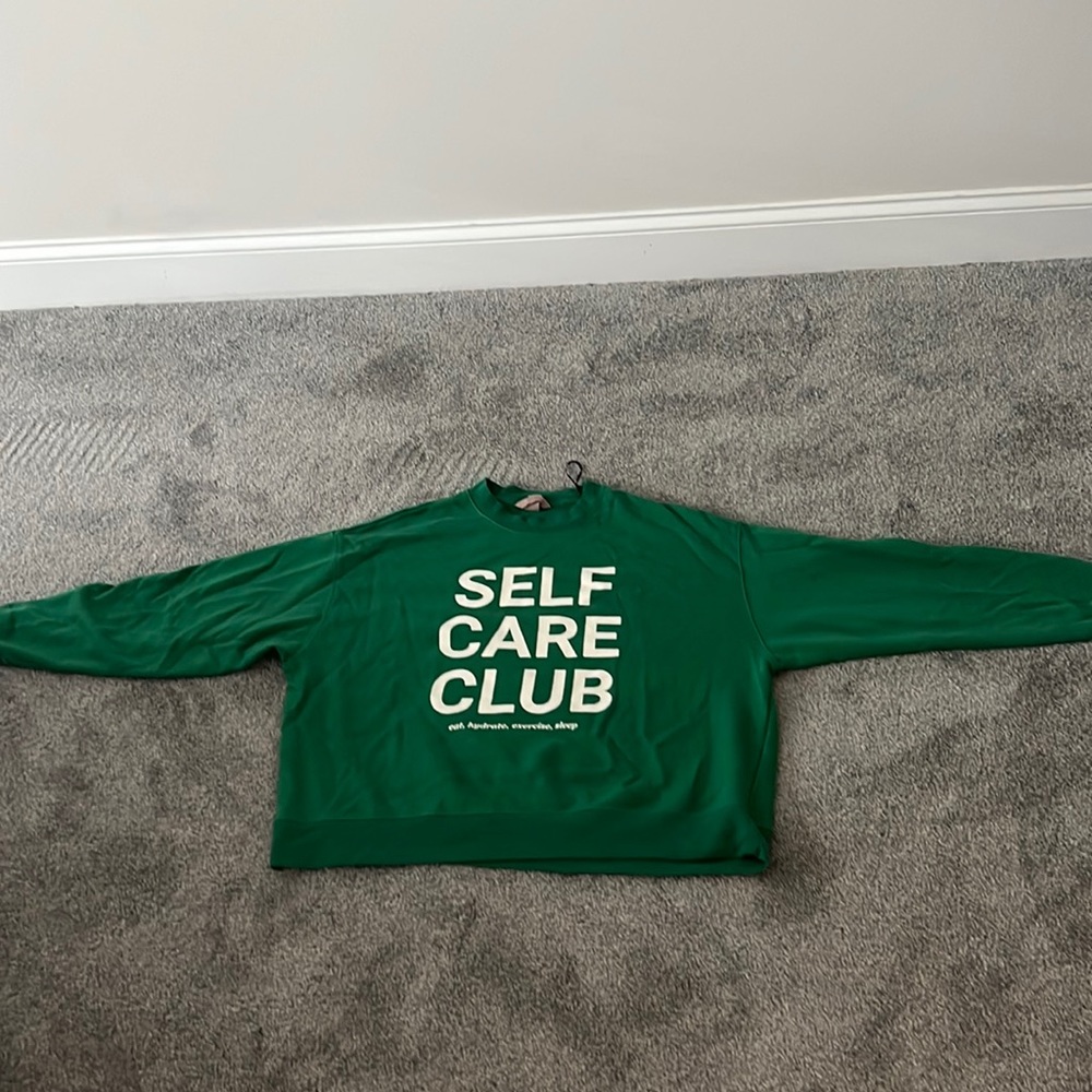 Green H&M sweatshirt “SELF CARE CLUB”